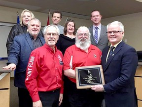 Representatives of the Kinsmen Club of Stony Plain pose with the Spruce Grove City Council earlier this year. Kin Canada is celebrating 100 years of service in 2020, which the city recognized in this moment, and the club is set to begin a virtual campaign of events to mark the occasion.