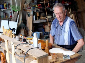 Graydon McCue prepares to work on a violin in his home in Spruce Grove Thursday, Aug. 6, 2020. The amatuer craftsman sat down with us to talk about his work for the first installment of our recurring Home Hobbies series.