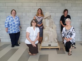 The Ursuline Sisters in Chatham donated a statue of St. Angela Merici to the new Catholic elementary school bearing her name on Monday. At front, from left, are Sister Noreen Allossery-Walsh and Sister Theresa Campeau. At back are Sister Sheila McKinley, vice-principal Sara Vadovic, principal Juli Faubert and Sister Pauline Maheux. (Trevor Terfloth/The Daily News)