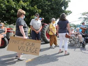 Wolfe Island residents rallied to protest the planned demolition of a historic house in Marysville on Sunday. (Meghan Balogh/The Whig-Standard)