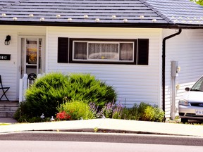 Weather extremes pose a challenge for municipalities going forward. Norfolk County issued a draft coping strategy last week. Here, a sidewalk on Main Street in Port Dover heaves upward during a spell of hot weather in July. – Monte Sonnenberg photo