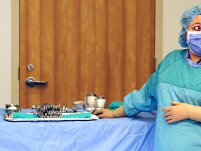 Registered practical nurse Paula Santos stands next to a table loaded with surgical instruments in an operating room of Belleville General Hospital. Quinte Health Care is expected to resume surgical operations at full capacity starting Sept. 1 after months of incremental increases due to the coronavirus pandemic.