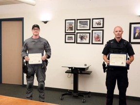 Consts. Kyle Chandler, left, and John MacRae are presented with Chief's Nickel Awards for their role in saving a man’s life in June.
