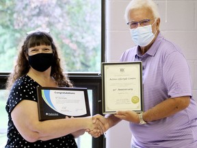 Active Lifestyle Centre executive director Linda Lucas (left( receives a certificate from Chatham-Kent-Leamington MPP Rick Nicholls marking the centre's 50th anniversary on Aug. 14. Mark Malone/Postmedia Network