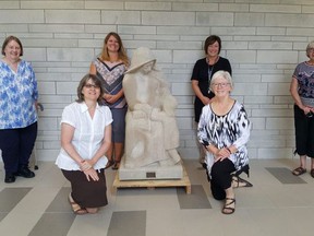 The Ursuline Sisters in Chatham have donated a statue of St. Angela Merici to the new Catholic elementary school bearing her name. At front, from left, are Sister Noreen Allossery-Walsh and Sister Theresa Campeau. At back are Sister Sheila McKinley, vice-principal Sara Vadovic, principal Juli Faubert and Sister Pauline Maheux. Trevor Terfloth/Postmedia Network