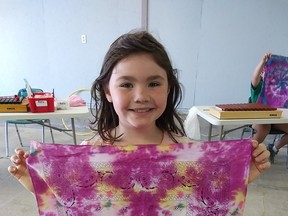 Karma-Lynn Grigg showing her beautiful tie dye made at Camp Fun Days.
Photo supplied