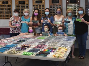 A group of high school students and community volunteers have been working to create 600 masks, to be handed out to John Maland High School students and staff next month for back to school.
Top Row: (L-r) Darlene Mullen, Alice Cooper, Erika Chong, Amanda Davidson, Jules Foose, Marilyn McIntosh and Darcey Davidson.
Bottom Row: (L-r) Darcie Poschner, Kierra Fish, Kiera Barnes.
(Emily Jansen)