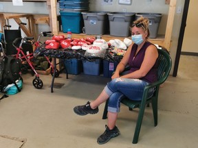 Sarah from Foothills Advocacy in Motion Society (FAIM) has been painting rocks (in background) that will be spread across High River during FAIM’s High River Half Marathon set to take place Aug. 29 – Sept. 12