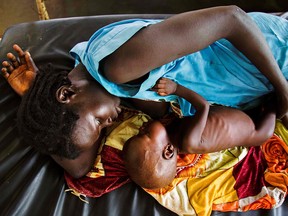 A mother breastfeeds her child at a clinic run by Doctors Without Borders in Aweil, South Sudan. (Albert Gonzalez Farran/Getty Images)