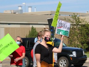 Outside of the local Strathcona County and Sherwood Park MLAs constituency offices on Chippewa Road on Friday, August 21, about 80 protestors rallied for more supports from the provincial government for safe school reopenings. Lindsay Morey/News Staff