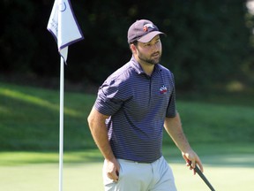 PETER RUICCI/Sault Star
Tyler Kasubeck putts out on No. 18 to win the Sault Golf Club's men's championship on Sunday