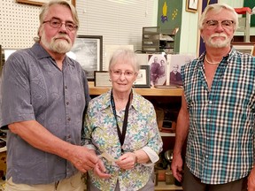 Brian Moore, left, and George Moore, grandsons of Thomas ‘Tom’ Moore Sr. presented the Smooth Rock Falls Historical Society with a donation from the Tom Moore Sr. Fund. Accepting on behalf of the society was Sheila Jacques, president of the society and a volunteer curator at the museum. SUBMITTED PHOTO