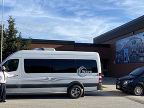 Bradley Oke, owner of Wave Limo & Tours, shows two of his luxury vehicles outside South Huron District High School in Exeter. Handout