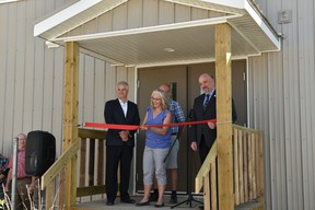 A new expansion portable for high school aged students was unveiled during a ribbon cutting ceremony on Aug. 21 at Brant Christian School. Here, Chair of the Brant Christian Society Board – Tonia Kohls, cuts the ribbon alongside (left) Palliser School Division Superintendant Dave Driscoll and (right) Palliser School Division Trustees Chair Robert Strauss.