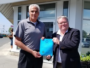 Timmins Chamber of Commerce President Val Venneri, left, was on hand as Timmins Deputy Mayor Andrew Marks declared Aug. 28-30 Canada United Days in the City of Timmins. SUBMITTED