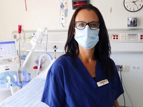 Registered nurse Emma Holmes stands in a patient room of the regional intensive care unit at Belleville General Hospital. The unit is about to expand to help address capacity issues. It's a timely upgrade: intensive care is needed for the sickest patients infected with coronavirus.