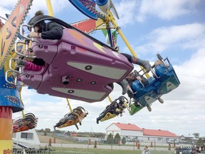 Visitors to the 2019 edition of the Brigden Fall Fair enjoy the midway. Peter Epp/Postmedia Network