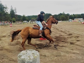 Photo by Leslie Knibbs/For The Mid-North MonitorOne of the many riders maneuvering around a barrel in the barrel race event at the Massey Horse Show.