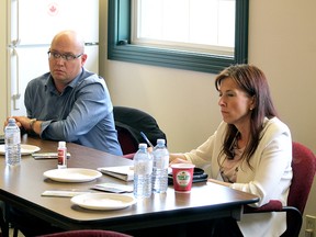Spruce Grove-Stony Plain MLA Searle Turton and Minister of Economic Development, Trade and Tourism Tanya Fir listen to concerns from area residents during a meeting in the town of Stony Plain Thursday, Aug. 20, 2020. Fir has been visiting a number of rural and semi-rural ridings to get a sense of the struggles of business communities outside of Calgary or Edmonton.