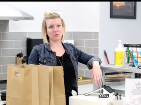 Aimee Hennig adjusts merchandise in her presently-close The Play Café in Spruce Grove. She is puzzled by the situation she finds herself in and worries about the future of her economic baby as the pandemic days drag on.