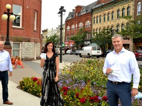 Schaeffler Canada auto-parts plant manager Rick Roes (left) and aerospace-parts plant manager Kent Brown (right) picked up a record amount of Downtown Dollars from Stratford City Centre BIA general manager Rebecca Scott (centre) Thursday afternoon. The purchase of Downtown Dollars is part of an employee-appreciation and economic-recovery initiative recently undertaken by Schaeffler, one of Stratford's largest employers. (Galen Simmons/The Beacon Herald)