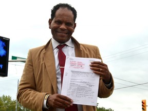 The Multicultural Association of Perth-Huron has recently incorporated its immigration services wing so it can access government funding and other resources to better serve newcomers in Huron, Perth, Wellington and Oxford counties. Pictured, association founder Dr. Gezaghn Wordofa holds up the board's approved application for incorporation. (Galen Simmons/The Beacon Herald)