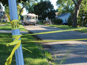 Yellow tape was up across a section of College Avenue Monday in Sarnia. City police are investigating a man's death in connection with an assault reported Sunday.