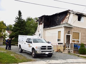 Investigators with the Ontario Fire Marshal's office were on the scene of a blaze at a St. Joseph Street residence on Sunday. Three people, including a toddler, escaped through an upper-floor window.