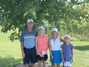 The team of Rob Standen (left), Madi Hickey, Ann Standen and Jordyn Hickey won the annual Cuzzy Bear Jr. Golf Camp tournament. Submitted