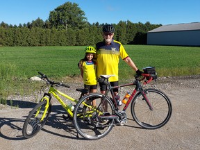 Mike Penner, right, set out on a 60-kilometre bike ride from Ridgetown to Iona Station on Sunday to raise money for annual Enbridge Ride to Conquer Cancer. His granddaughter, Bela Aguirre, joined him for the first 10 kilometres. (Handout/Postmedia Network)
