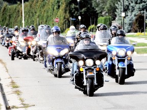 Members of the Gold Wing Road Riders Association will be participating in their annual toy ride on Sept. 20, delivering toys to the Salvation Army church in Chatham later that afternoon. They’re shown delivering toys to the church in this file photograph. File photo/Chatham This Week