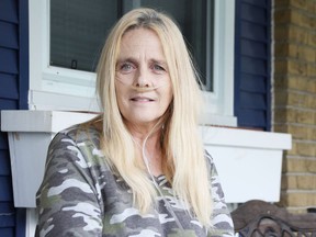 Sandy Perron, 57, was photographed at her Sarnia home on Aug. 28. She's waiting for a double-lung transplant and raising money to pay for her stay in Toronto. Tyler Kula/Postmedia Network