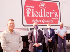 Provincial and federal dignitaries were in Simcoe Thursday to announce funding support for upgrades to the R. Fielder Meat Products plant on Grigg Drive. From left are Brian Fiedler, Bay of Quinte MP Neil Ellis, Ontario Agriculture Minister Ernie Hardeman, and Haldimand-Norfolk MPP Toby Barrett. – Monte Sonnenberg