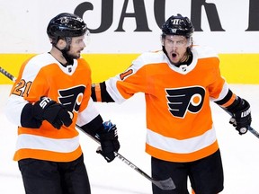 Scott Laughton (21) of the Philadelphia Flyers celebrates with Travis Konecny (11) after scoring a goal on the Washington Capitals during the third period in an Eastern Conference round-robin game during the 2020 NHL Stanley Cup playoffs at Scotiabank Arena on August 06, 2020, in Toronto. (Photo by Andre Ringuette/Freestyle Photo/Getty Images)