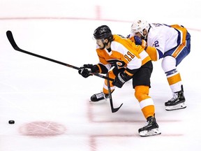 Philadelphia Flyers' Travis Konecny (11) is defended by New York Islanders' Nick Leddy (2) during the first period in Game 1 of an Eastern Conference second-round series during the 2020 NHL Stanley Cup Playoffs at Scotiabank Arena on August 24, 2020 in Toronto, Ontario. (Photo by Elsa/Getty Images)