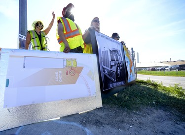 Agriculture Strong: Truckers and Farmers Fed Cities stand a few feet from the edge of the curb at the entrance of Sofina Fearmans Pork, Inc. processing facility in Burlington in support of the transport drivers, food safety and to educate the public on the realities of animal agriculture Aug 20. Diana Martin, Ontario Farmer