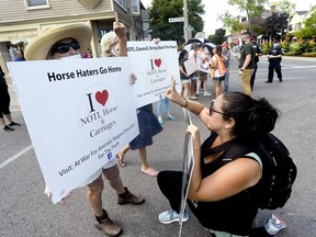 Niagara-on-the-Lake locals and an ARA square off during the At War For Animals Niagara (AWFAN) activist action and Take Back NOTL and Locals For Carriages counter-protest in Old Town, Niagara-on-the-Lake Aug. 23. (DIANA MARTIN, Ontario Farmer)