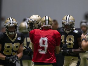 Wearing the name of Jacob Blake on their helmets, the offence breaks huddle with New Orleans Saints quarterback Drew Brees during training camp on Thursday.