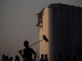 People view the damage at the site of Tuesday's blast in Beirut's port area, Lebanon August 7, 2020. REUTERS/Hannah McKay     TPX IMAGES OF THE DAY ORG XMIT: GAZ121