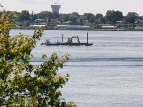 The Ogdensburg water tower is seen as a barge makes its way upriver past Windmill Point on Friday, Aug. 7, 2020. (RONALD ZAJAC/The Recorder and Times)