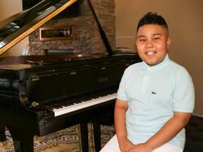 Bentley Penn, 7, next to his piano at his home in Fort McMurray on Saturday, August 1, 2020. Sarah Williscraft/Fort McMurray Today/Postmedia Network