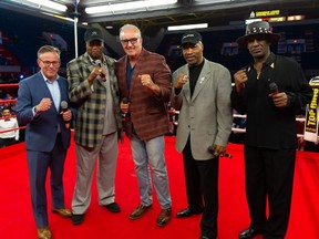 Terry Marcotte, left, Larry Holmes, Gerry Cooney, Ray Mercer and  Michael Spinks stand in the boxing ring  on Sunday on June 2, 2019 in Cornwall, Ont.   Bob Lefebvre/Cornwall Standard-Freeholder/Postmedia Network