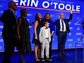 Newly elected Conservative Leader Erin O’Toole stands with his parents and his wife and children after his winning speech following the Conservative party of Canada 2020 Leadership Election in Ottawa, Ontario, Canada August 24, 2020.