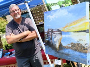 David Fife of Chatham, Ont., shows his painting Beached Buddies at Discover Art Blenheim in Blenheim, Ont., on Saturday, Aug. 15, 2020. (Mark Malone/Chatham Daily News)