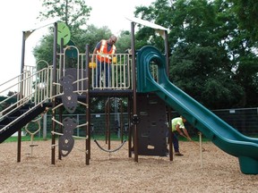 Adam Parsons, Owen Sound's manager of parks and open space, completes a final inspection of the new play structure at Timber McArthur Park. DENIS LANGLOIS