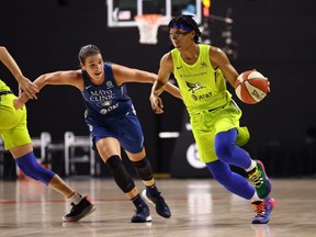 Minnesota Lynx's Bridget Carleton, left, defends Dallas Wings' Allisha Gray on Wednesday, Aug. 19, 2020, at Feld Entertainment Center in Palmetto, Fla. Copyright 2020 NBAE (Photo by Ned Dishman/NBAE via Getty Images)