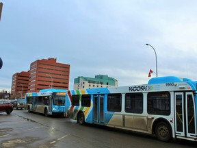 Transit buses drive down Franklin Avenue in downtown Fort McMurray on Saturday January 30, 2016. Vince Mcdermott/Fort McMurray Today/Postmedia Network ORG XMIT: POS1607121933479000