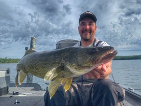 Jamie Bruce holds up a 30-inch, ten pound plus walleye that he caught on day two of the Kenora Walleye Open en route to a second place finish.