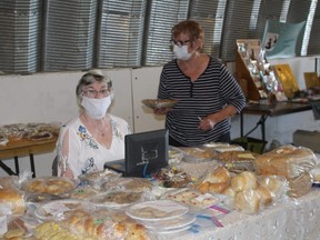 Pat Dorff and Bonnie Axcell were representing the Anglican Church bake sale. The money raised would go to roof repairs on the church. tp