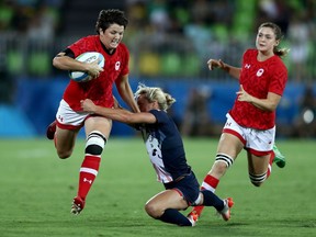Britt Benn of Canada is tackled by Claire Allan of Great Britain during the women's bronze medal rugby sevens match on Aug. 8, 2016, during the 2016 Summer Olympics in Rio de Janeiro, Brazil. (Getty Images)